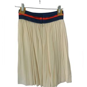 KOEL pleated beige skirt. Satin band in blue and orange size 4